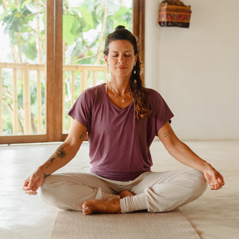 woman sitting quietly in meditation