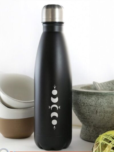 Bouteille gourde en inox avec capot en métal, de couleur noire avec des dessins de lune blancs