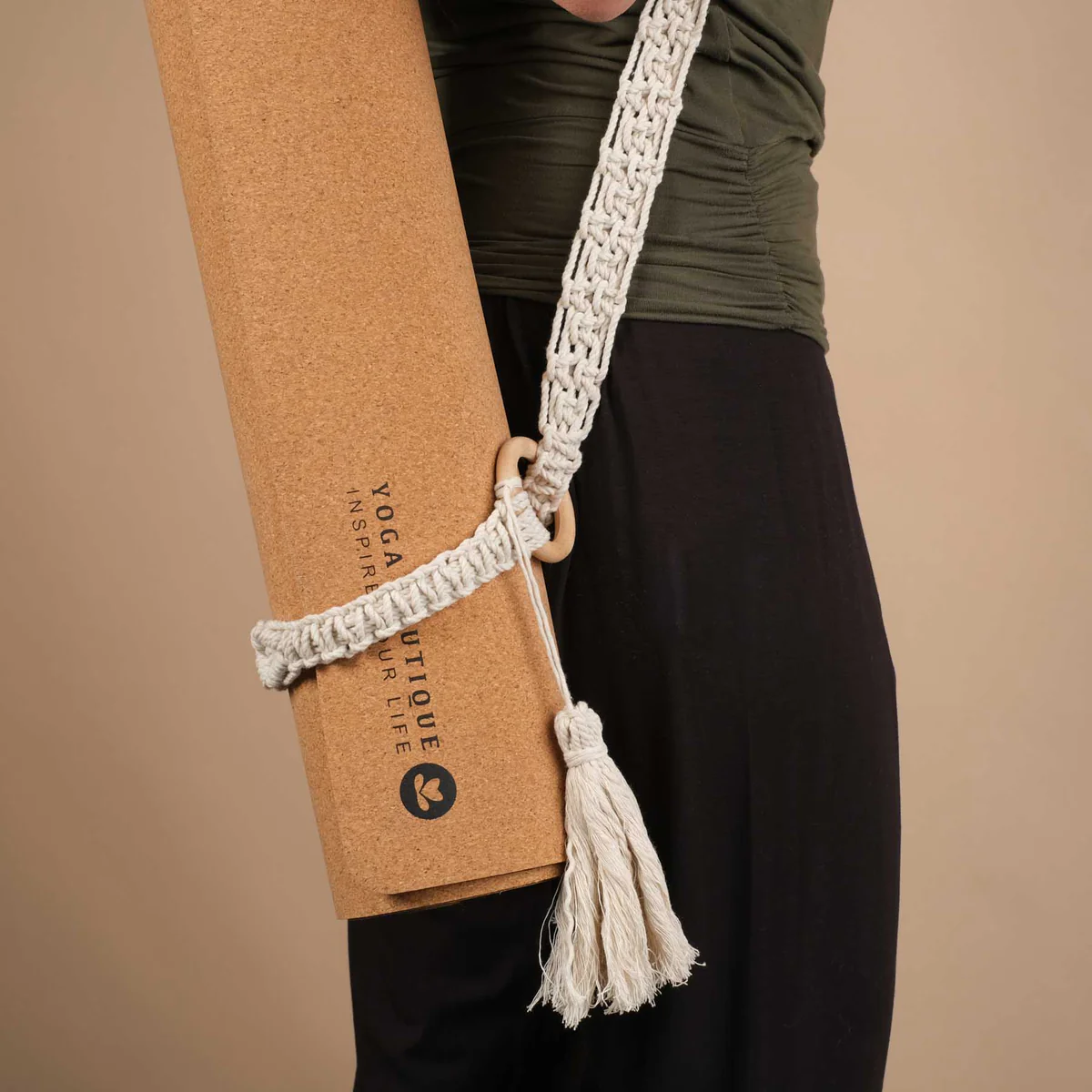 Cork yoga mat with macrame strap.