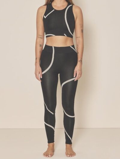 Black leggings with white graphic patterns and matching sports bra