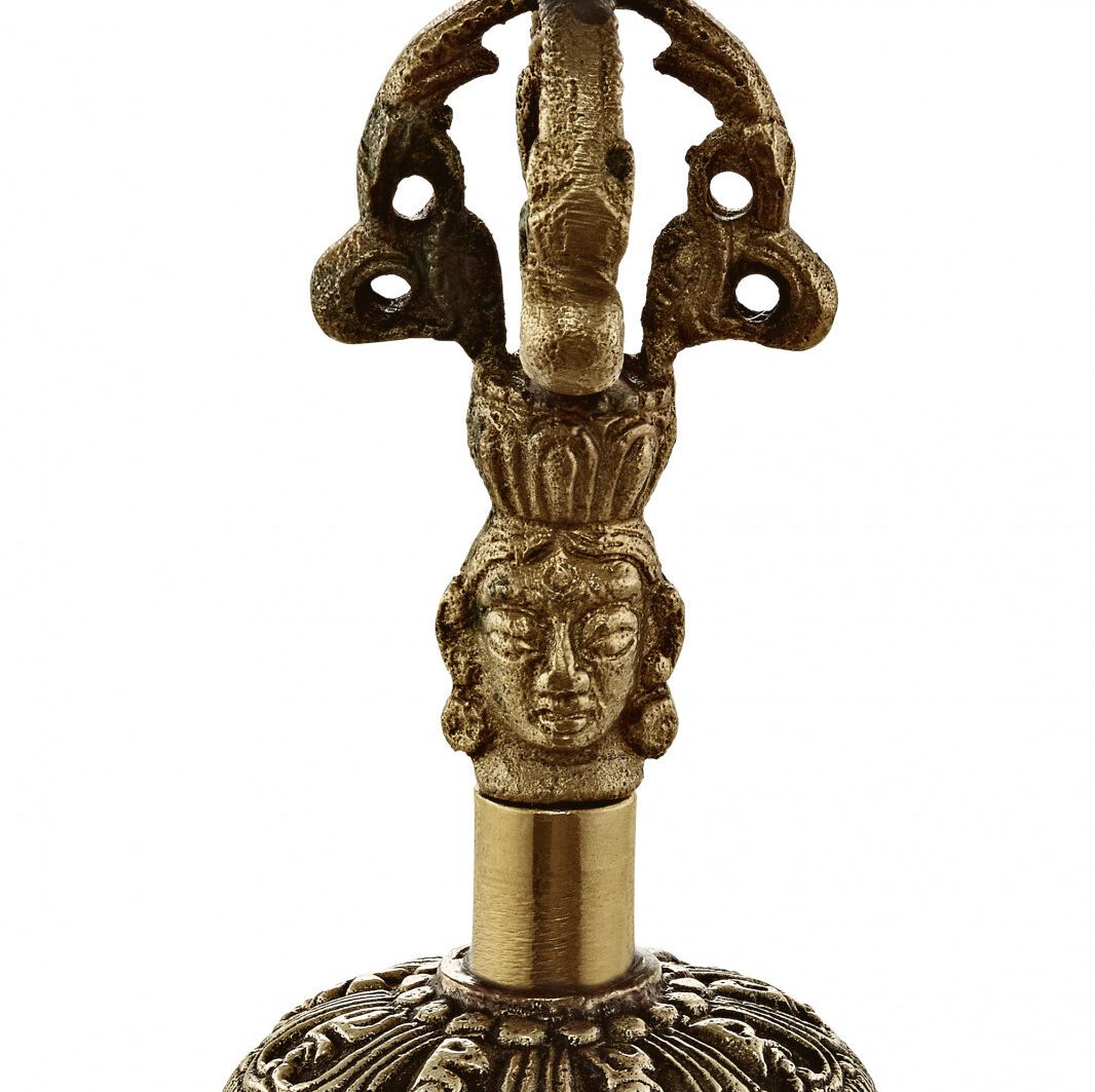 Decorative bronze statue with sculpted face