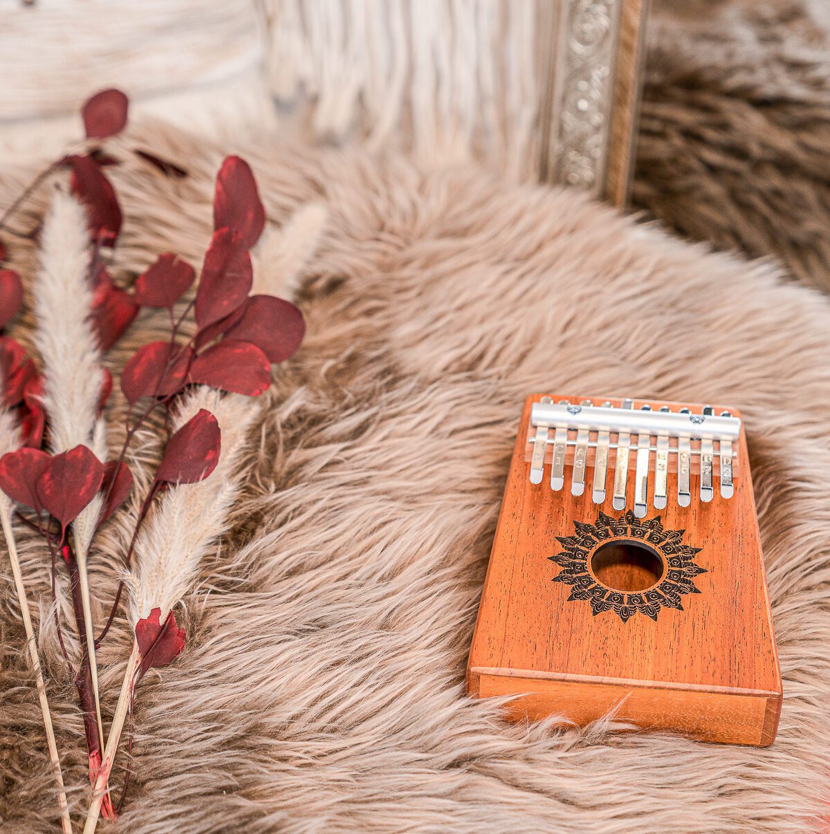 Wooden kalimba on a fur rug