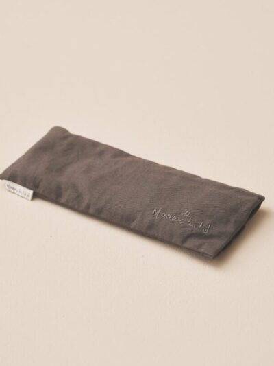 Grey relaxing pillow on a beige background
