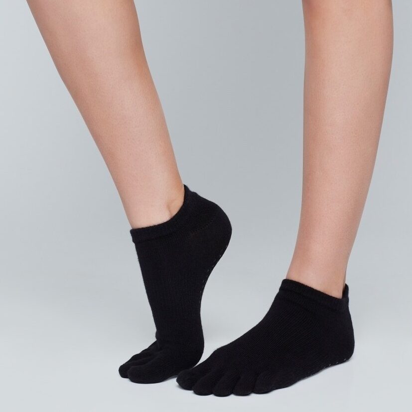 Black toe socks on feet