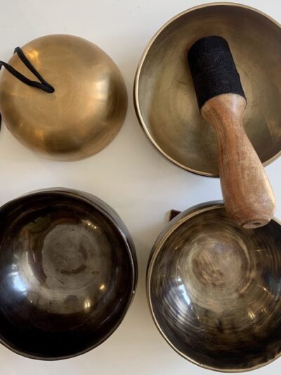 Metal Tibetan bowls with wooden mallet