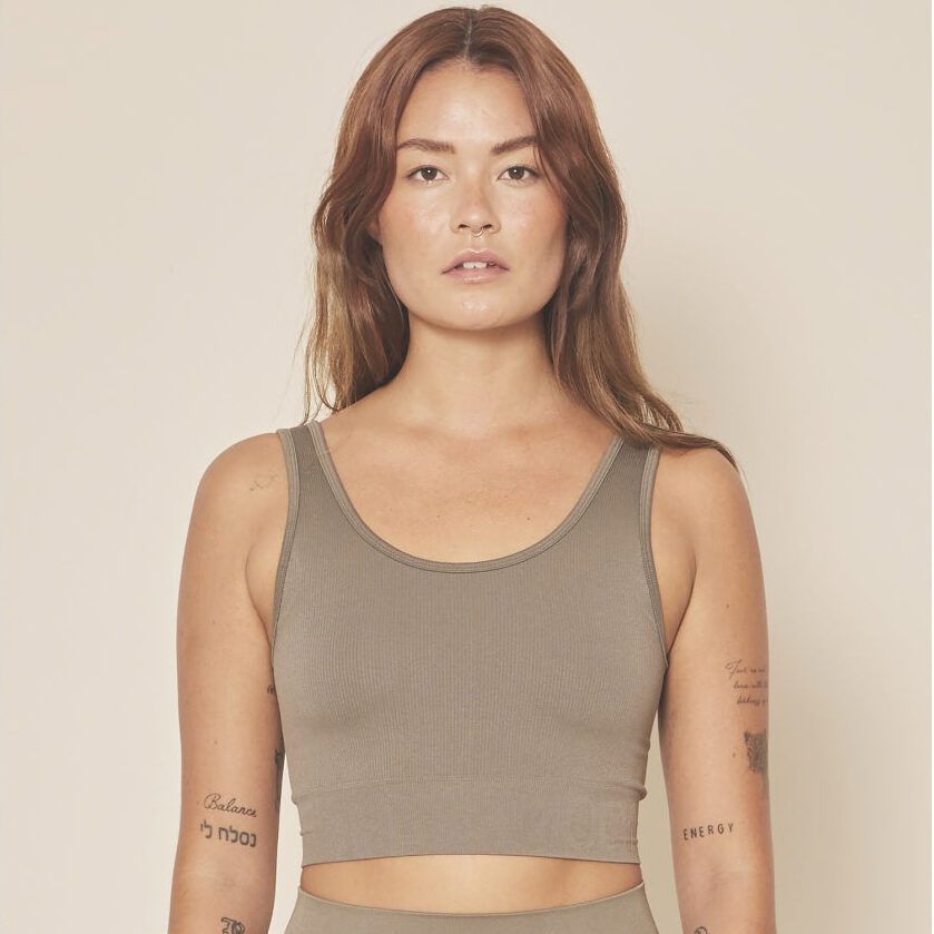 Woman wearing a beige crop top