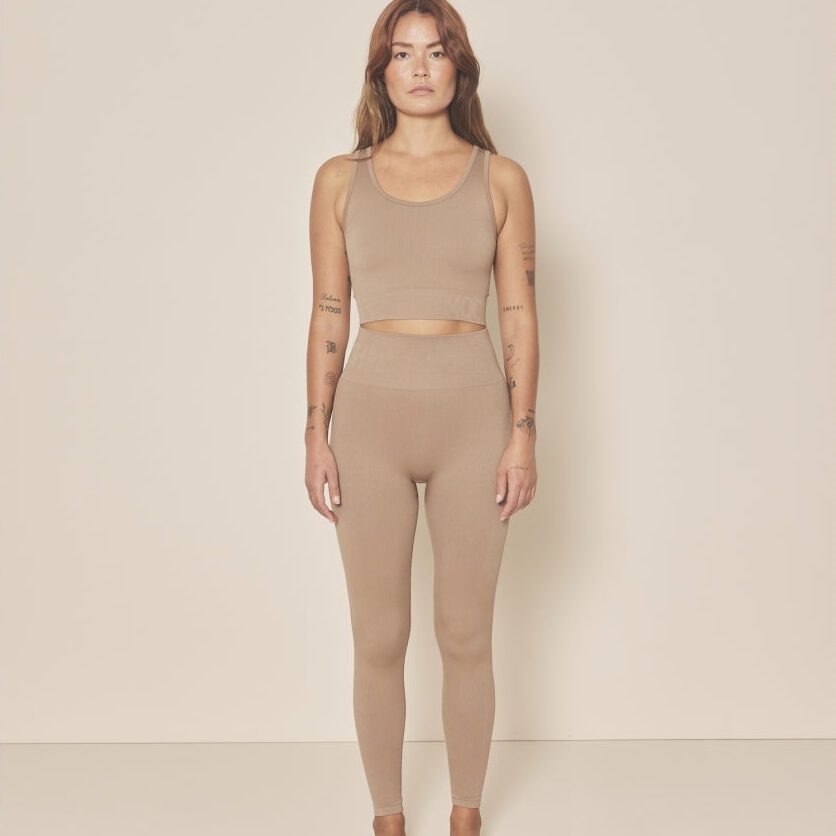Woman wearing a minimalist beige sports set