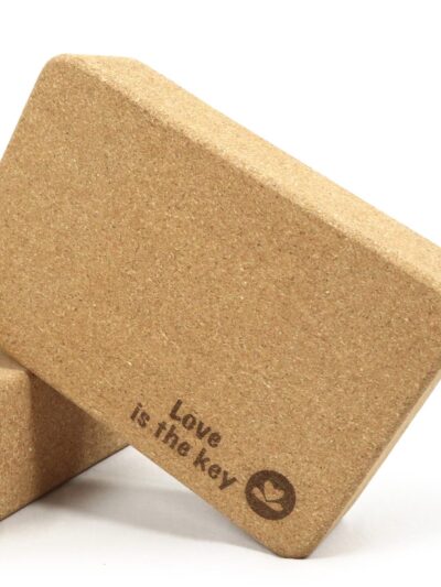 Wide and thick cork yoga block with Love is the key text Yoga Boutique