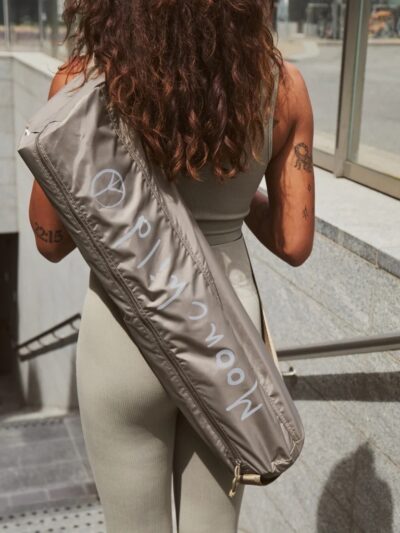 Lightweight water-repellent iced brown yoga mat bags with Moonchild logo