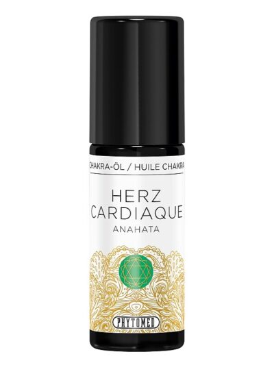 Dark glass bottle of heart chakra massage oil by Phytomed