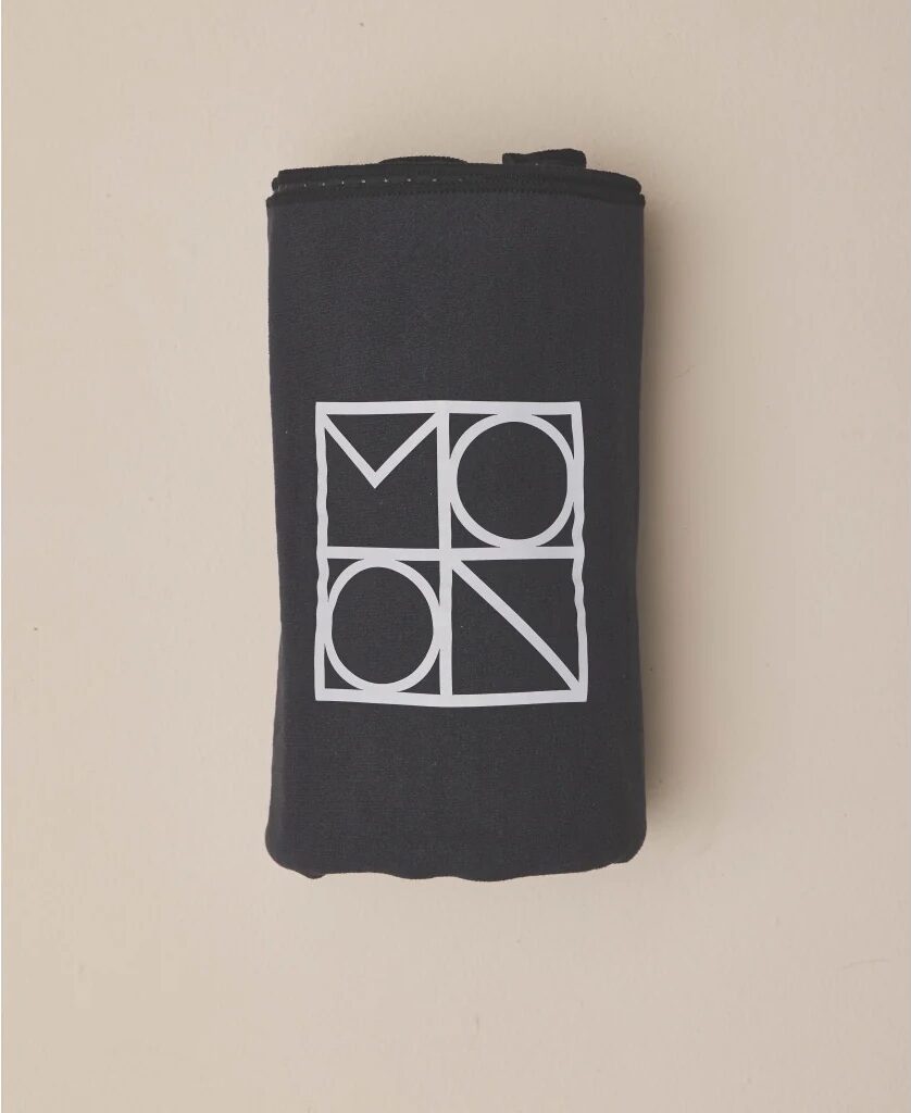 Black folded towel with MOON logo