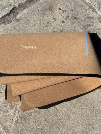 Folded cork yoga mat with colorful patterns, French brand Yogom